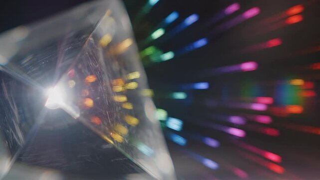 Prism refracting light into spectrum during cinematic close-up with lens flare