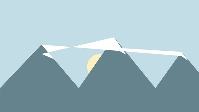 Snow capped mountain range with pale sun behind peaks on blue sky