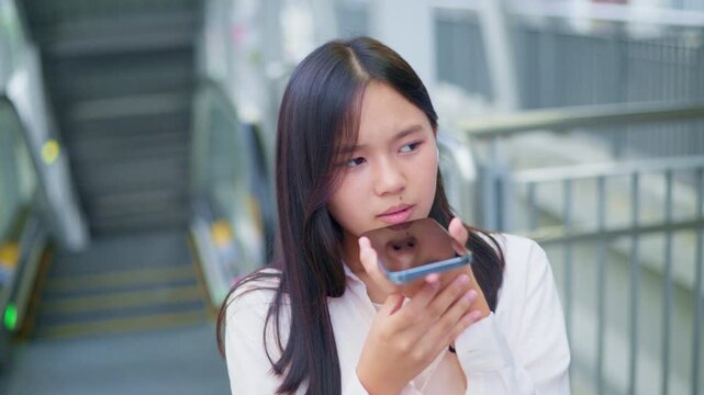 woman talking and command an AI voice assistant on a smartphone as a conceptual backdrop for artificial intelligence technology communication phone innovation virtual assistant and smart lifestyle