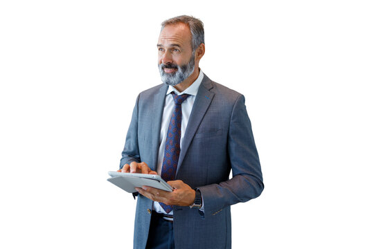 Mature businessman holding digital tablet planning success