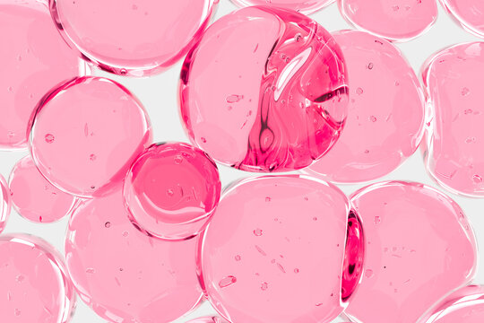 Abstract pink transparent bubbles close-up air particles, symbolizing whitening skin, skincare and beauty. Soft cosmetic texture background for facial care, gel, moisturizing and cosmetic concepts.