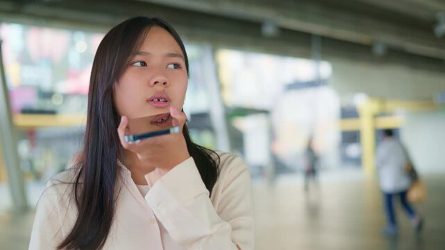 woman talking and command an AI voice assistant on a smartphone as a conceptual backdrop for artificial intelligence technology communication phone innovation virtual assistant and smart lifestyle
