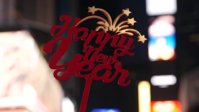 Happy New Year text sign on Times Square in New York City, United States. Illuminated screens during Christmas holidays in December on Manhattan. Festive celebration on Broadway in USA. Glowing lights