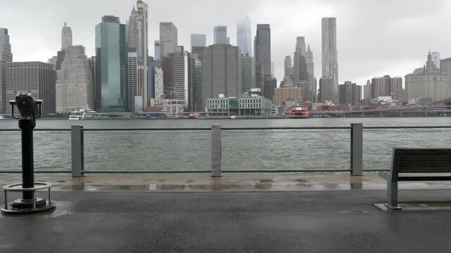 Manhattan downtown skyline from Brooklyn Bridge Park, New York City, United States. Financial district skyscrapers buildings. American architecture of business center. Tower viewer binocular telescope