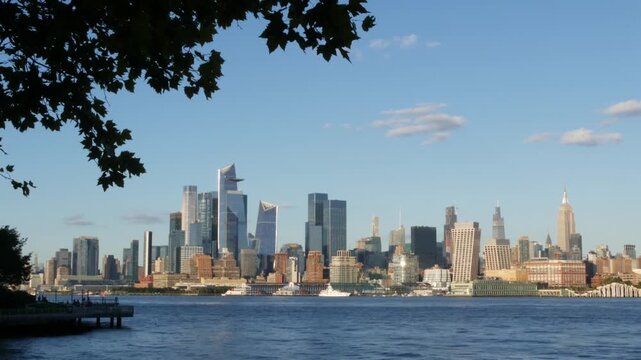 New York City Manhattan Midtown skyline, Chelsea and Hudson Yards towers from New Jersey, Hoboken pier, United States. River waterfront urban cityscape with skyscraper buildings, American architecture