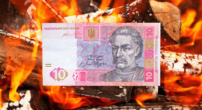 Hryvnia Ukrainian national currency on a black background. Beautiful money of Europe	
