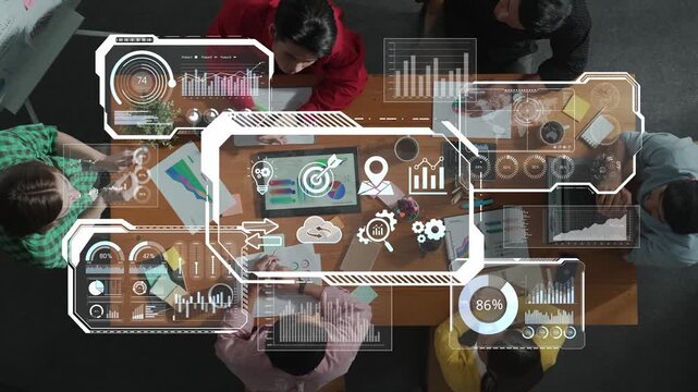 A top-down view of a diverse team collaborating in a modern office setting, engaged in data analysis and strategic planning using digital tools and graphics. Raster