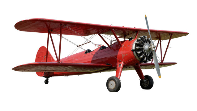 Vintage red biplane with radial engine and propeller, isolated on transparent background