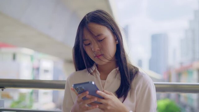 anxious worried teen girl with her smartphone as a conceptual footage for cyberbullying social media trauma, teenager mental health crisis, depression and panic attack