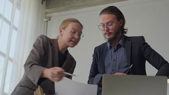 Business colleagues arguing about financial data in office
