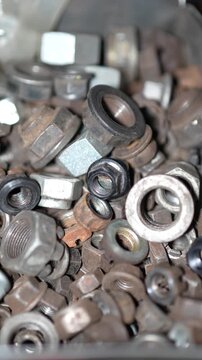 Nuts and Bolts Pile on Workshop Table, Macro Detail of Industrial Hardware Collection