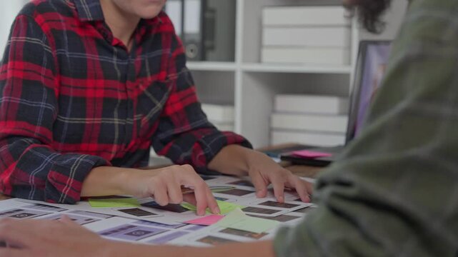 Ux ui designers collaborating on website wireframe
