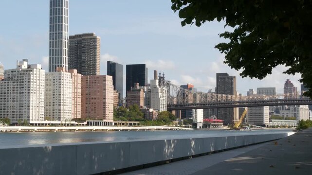 New York City Manhattan Midtown Queensboro bridge architecture, United States. Metallic bridge over East River, East Side residential district skyline from Roosevelt island. NYC cityscape, Turtle Bay.