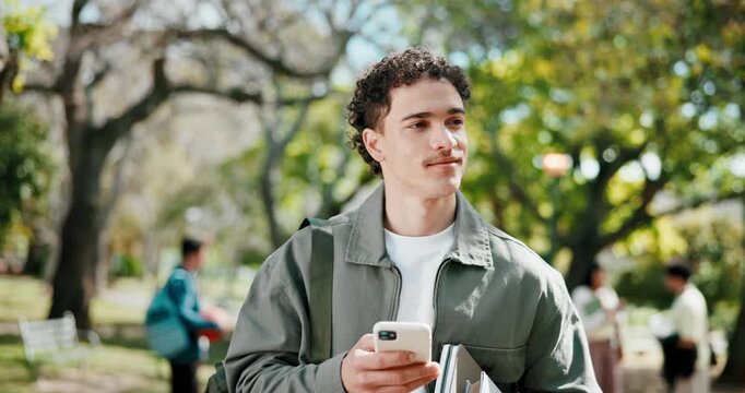 Student, man and smile at university campus with phone, text message and books for knowledge growth. Happy, person and walk outdoor at college with tech, social media or website for higher education.