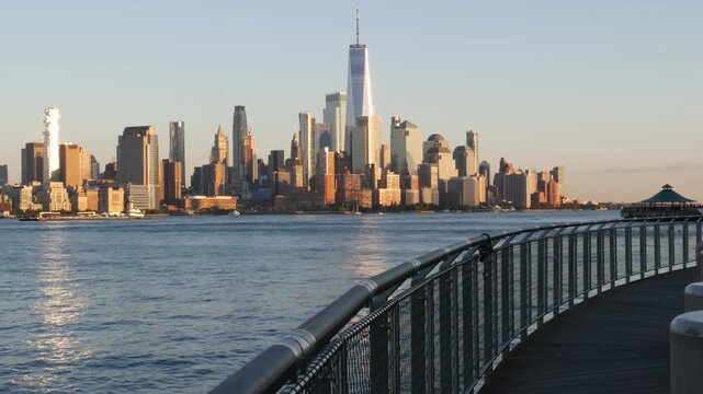 New York City Manhattan Downtown Financial District skyline, World Trade Center tower from New Jersey, Hoboken pier, United States of America. River waterfront urban cityscape with skyscraper building
