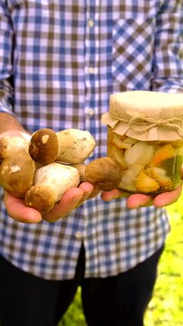 Wild mushrooms in a hand. Selective focus.