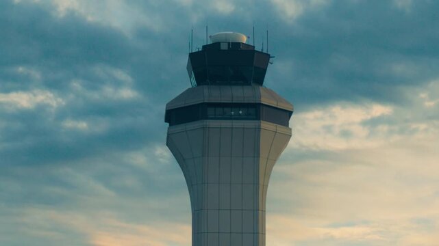 Detroit, Michigan - September 21, 2026: The Air Traffic Control Tower at Detroit Metropolitan Wayne County Airport (DTW) under a cloudy sky.