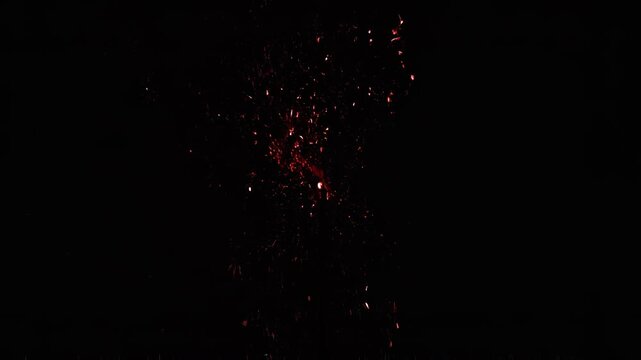 Red energy burst with electrical discharge and particle effects in dark background cinematic motion