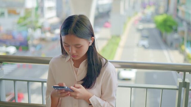 anxious worried teen girl with her smartphone as a conceptual footage for cyberbullying social media trauma, teenager mental health crisis, depression and panic attack