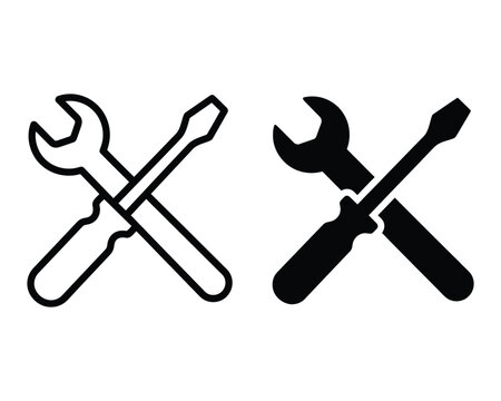 Two crossed tool icons a wrench and screwdriver in black and white
