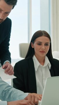 Male CEO business leader helping office coworkers with laptop project indoors team meeting boss man guide multiethnic colleagues businesswoman Arabian businessman brainstorm sales paperwork teamwork