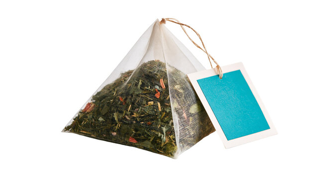 Pyramid tea bag with dried green tea leaves and a blank blue paper tag