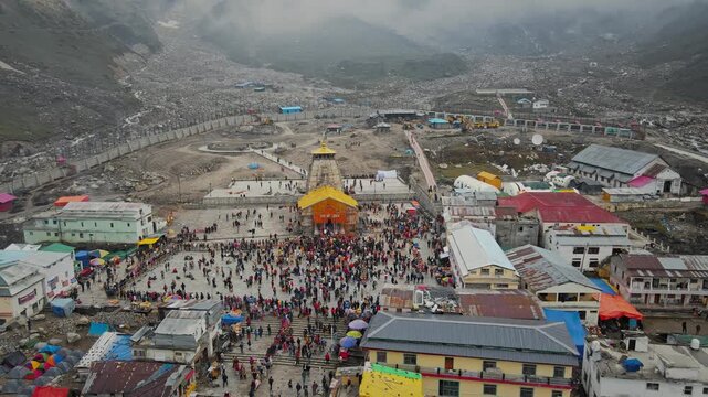 A breathtaking aerial drone view of the sacred Kedarnath Temple, one of the holiest Hindu pilgrimage sites and one of the twelve Jyotirlingas dedicated to Lord Shiva, located in the Garhwal Himalayas.