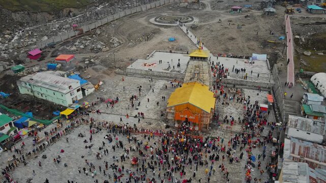A breathtaking aerial drone view of the sacred Kedarnath Temple, one of the holiest Hindu pilgrimage sites and one of the twelve Jyotirlingas dedicated to Lord Shiva, located in the Garhwal Himalayas.