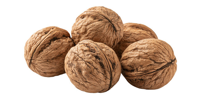 Group of whole brown walnuts with textured shells