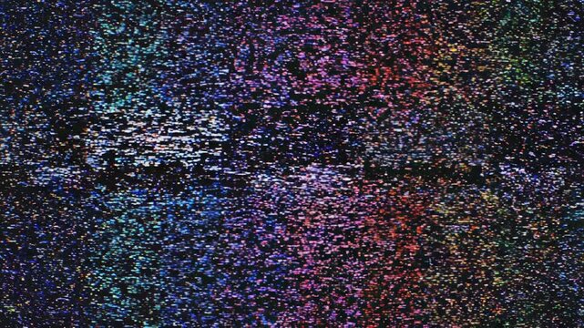 Television static test pattern with digital distortion and color noise during a broadcast signal interruption