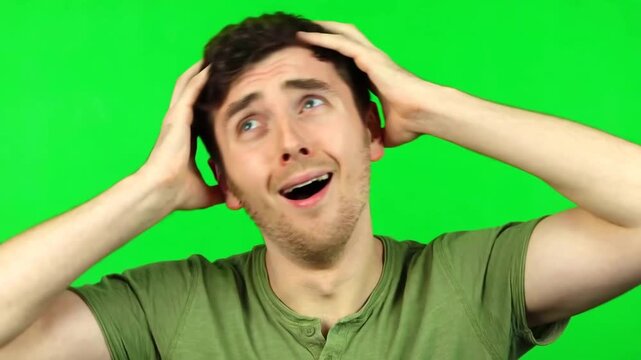 Man making a mind blown gesture with explosion motion on green screen