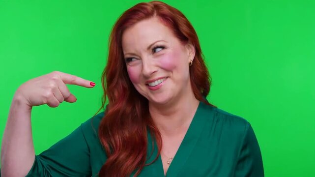 Smug man pointing at himself with a confident smirk on green screen