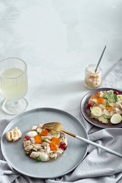 Savory aspic jellied chicken with vegetables appetizer