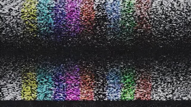 Television test pattern glitching with analog static and color bars during broadcast disruption