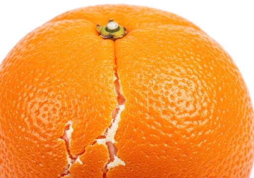 Macro of fresh orange with partially peeled textured rind