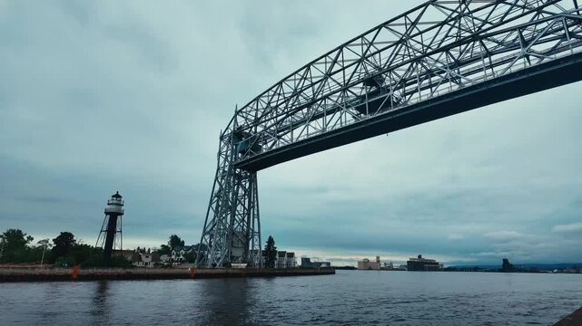 A timelapse of an aerial bridge in Duluth, Minnesota rising and allowing boats to pass under it.