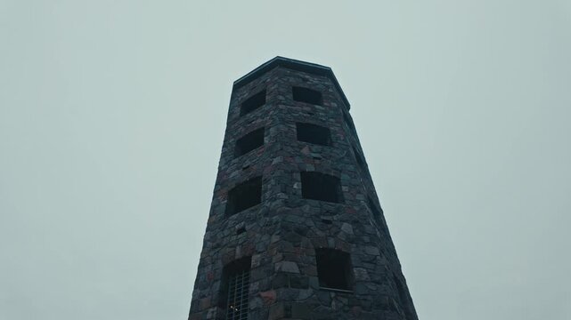 A low angle moving shot of Enger Tower in Duluth, Minnesota.