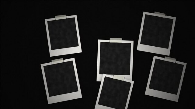 Cinematic floating blank instant photo frames with tape on black background motion studio style.