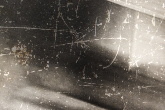 Dark grunge film texture with distressed scratches for horror poster backgrounds