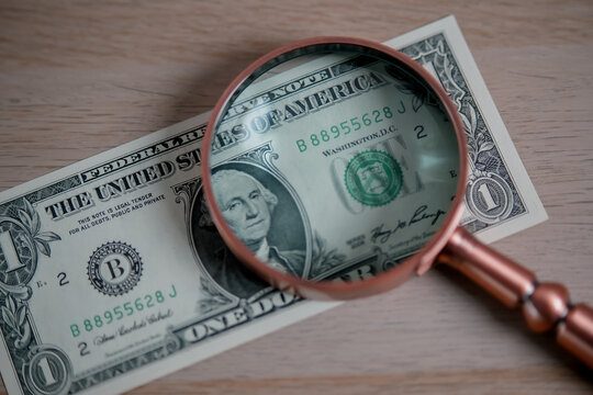 Magnifying Glass Over US Dollar Banknote Representing Money, Finance, Banking, Investment, Wealth, Currency Exchange, Economy, and Financial Analysis