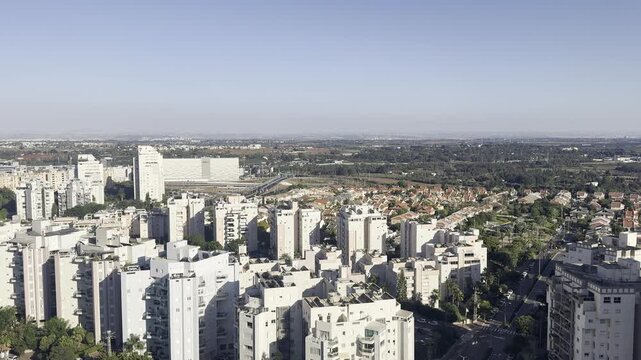 Netanya, Israel, 21 September 2026. Midday view of the city with modern buildings and the Judean Hills visible on the horizon.