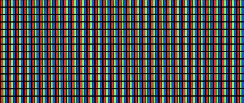 LCD screen pixel grid macro texture. Red, green, and blue subpixels on a digital monitor display