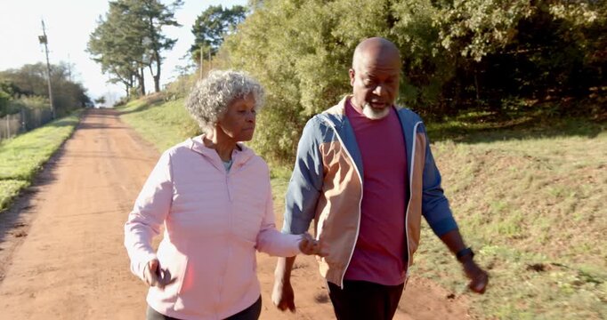Lifestyle videos outdoor of people doing activities, walking outdoors on dirt road, elderly couple e