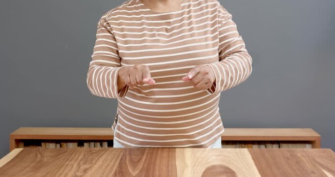Close up of people talking to the camera, using sign language, woman communicating with hand gesture