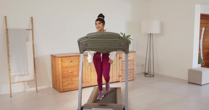 Lifestyle videos indoor of people doing activities at home, running on treadmill, woman exercising