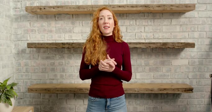 Close up of people talking to the camera, woman in casual outfit, gesturing with hands