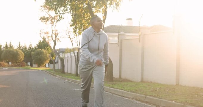 Lifestyle videos outdoor of people doing activities, jogging on suburban street, person in gray trac
