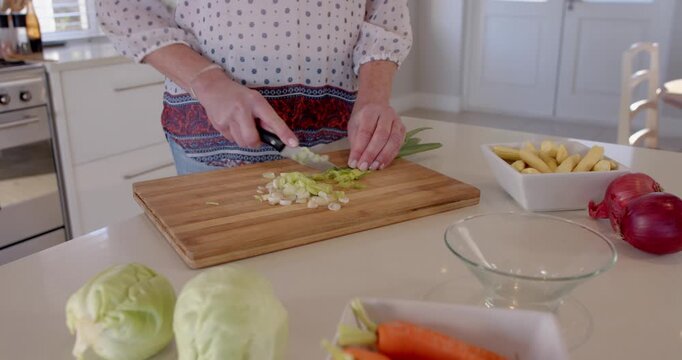 Preparing fresh vegetables on kitchen counter for healthy home-cooked meal