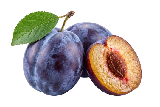 Fresh ripe plums whole and halved with green leaf