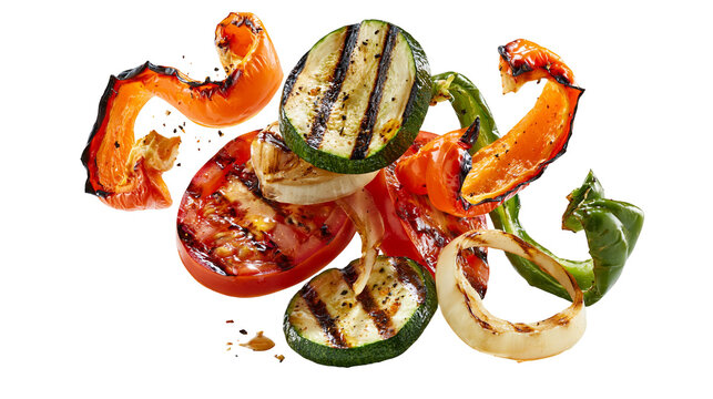 Grilled zucchini slices with charred red bell pepper and onion rings